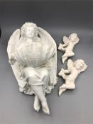 An angelic wall font with two cherubs