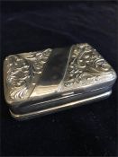 A white metal pill box