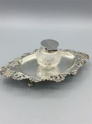 A silver inkstand 61/4" x 4" oval with a cut glass ink pot centre with plain lid and mount. Walker &