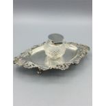 A silver inkstand 61/4" x 4" oval with a cut glass ink pot centre with plain lid and mount. Walker &