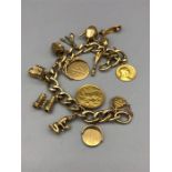 A 9ct gold charm bracelet with 1902 gold sovereign (60g)