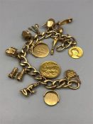 A 9ct gold charm bracelet with 1902 gold sovereign (60g)