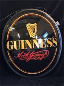 A large illuminated Guinness pub sign with swing bracket, taken out of box for photo.