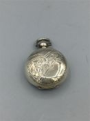 A silver sovereign case, engraved all over, hallmarked Chester 1909/10