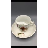 A Staffordshire Gentleman's moustache cup and saucer