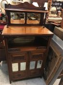 A Chiffonier with mirrored panels and back