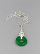 A silver jade and pendant necklace