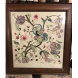 A framed needlework piece