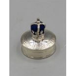 A silver pill box with pincushion to the lid in the form of a crown