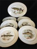 A set of six Rosenthal plates and serving plate featuring depiction of fish