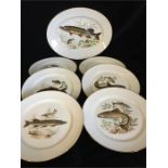 A set of six Rosenthal plates and serving plate featuring depiction of fish