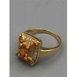 A 14ct yellow gold citrine and diamond cluster ring