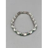 A silver CZ opal and emerald bracelet