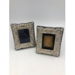 A pair of small rectangular, hallmarked silver ornate picture frames