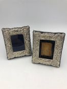 A pair of small rectangular, hallmarked silver ornate picture frames