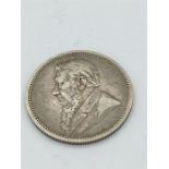 An 1895 South African Paul Kruger 2 Shilling silver coin