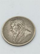 An 1895 South African Paul Kruger 2 Shilling silver coin