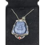 An unusual silver Abalone Pendant necklace in the form of a Budha inset with rubies