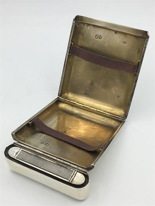 A silver cigarette case, built in match striker, makers mark SM Hallmarked London 1883/84 - Image 2 of 2