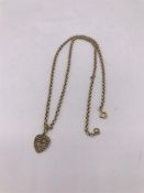 An 18ct gold chain with a 15ct gold pendant (3.7g and 1.5g)