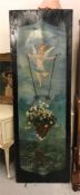 A Vintage painted panel with Cupid style figure and flower basket