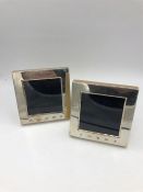 A pair of small square Carr's hallmarked (2000) silver picture frames. 10 x 10 cm.