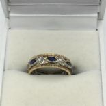 A 9ct gold Diamonds and created sapphire ring