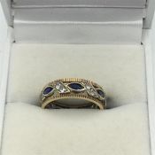 A 9ct gold Diamonds and created sapphire ring