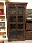 A large carved display cabinet