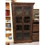 A large carved display cabinet