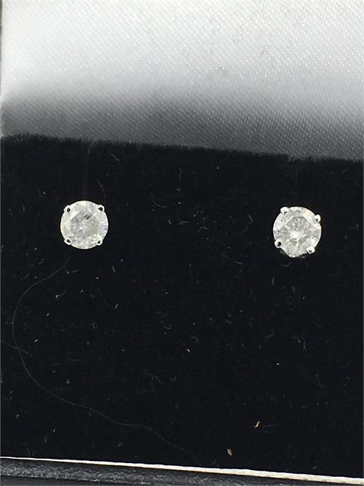 A Pair of white gold diamond stud earrings of 40 points