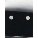 A Pair of white gold diamond stud earrings of 40 points