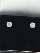 A Pair of white gold diamond stud earrings of 40 points