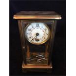 A Brass mantle clock with enamel face