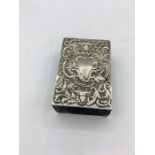 A silver matchbox cover with heavily decorated frontispiece, hallmarked London 1892/3