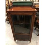 A galleried top mahogany display cabinet.