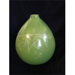 Green vase with leaf and vine decoration