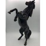 A figure of a rearing horse