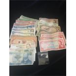 30 Assorted banknotes, including East Caribbean, three one dollar and two 20 dollar notes, Mexico