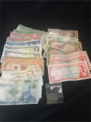 30 Assorted banknotes, including East Caribbean, three one dollar and two 20 dollar notes, Mexico