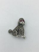 A silver Marcasite Poodle Brooch with ruby eyes