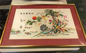 A framed Chinese silk print