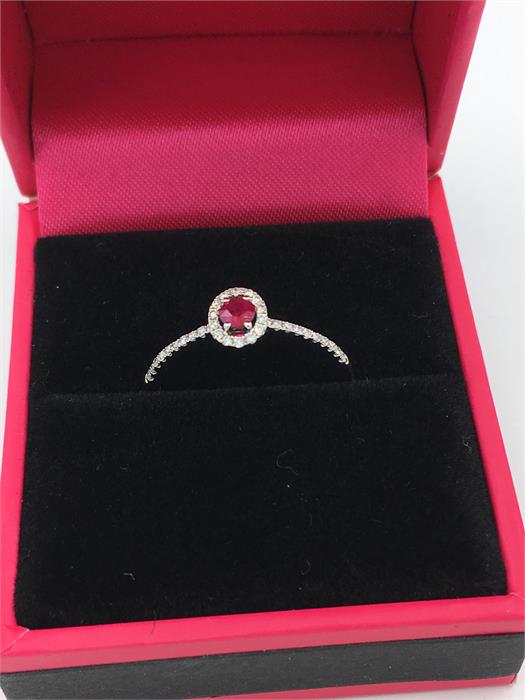 An 18ct white gold ruby and diamond cluster ring