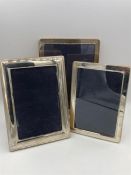 Three assorted silver photo frames