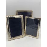 Three assorted silver photo frames