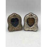 A pair of small ornate hallmaked silver picture frames