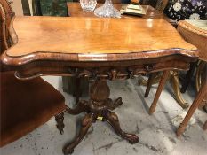 A card table on pedestal base, rosewood.