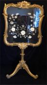A gilt framed frire screen with floral design