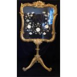 A gilt framed frire screen with floral design