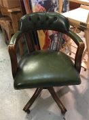 A Green leather captains chair